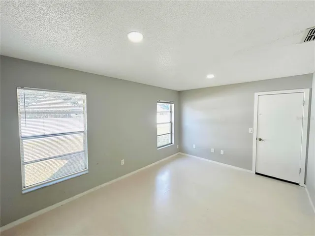 a bathroom with a sink a toilet a shower and a mirror