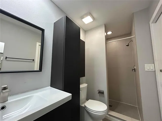 a bathroom with a sink and mirror
