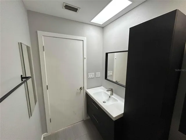 a bathroom with a shower and a toilet