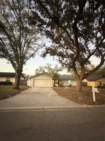 a house view with a backyard space