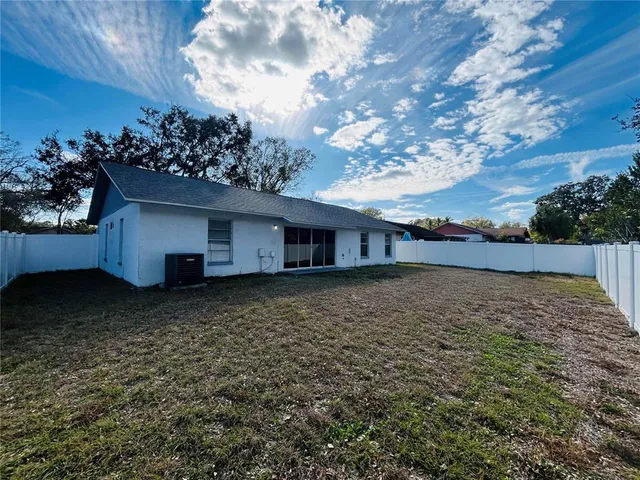 a view of backyard with green space