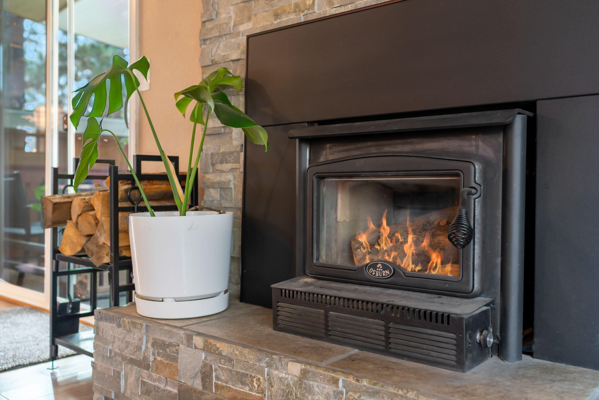 16879 Elsinore Road Bend, OR 97707 - Photo 5 of 48 a living room with furniture a flat screen tv and a fireplace