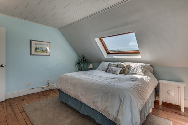37 Wellman Street, Unit 3 Beverly, MA 01915 - Photo 14 of 21 a bedroom with a bed and a window