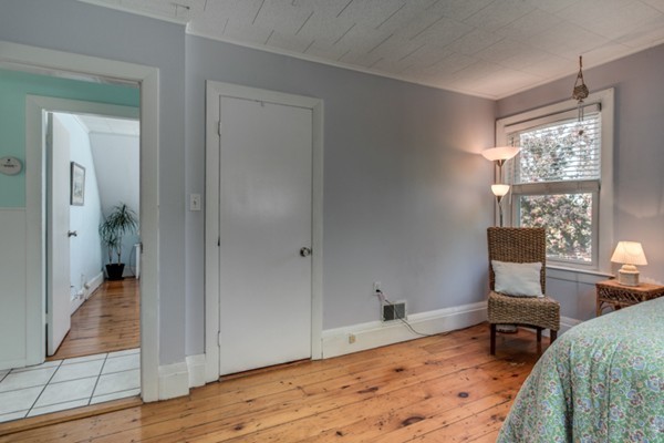 37 Wellman Street, Unit 3 Beverly, MA 01915 - Photo 16 of 21 a bedroom with furniture and a window