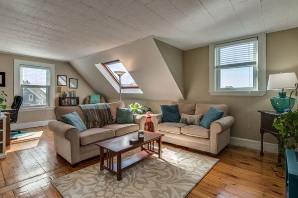 37 Wellman Street, Unit 3 Beverly, MA 01915 - Photo 3 of 21 a living room with furniture and a rug