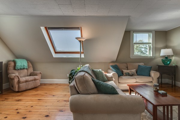 37 Wellman Street, Unit 3 Beverly, MA 01915 - Photo 4 of 21 a living room with furniture and a wooden floor