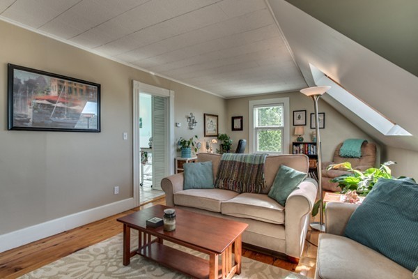 37 Wellman Street, Unit 3 Beverly, MA 01915 - Photo 5 of 21 a living room with furniture and a wooden floor