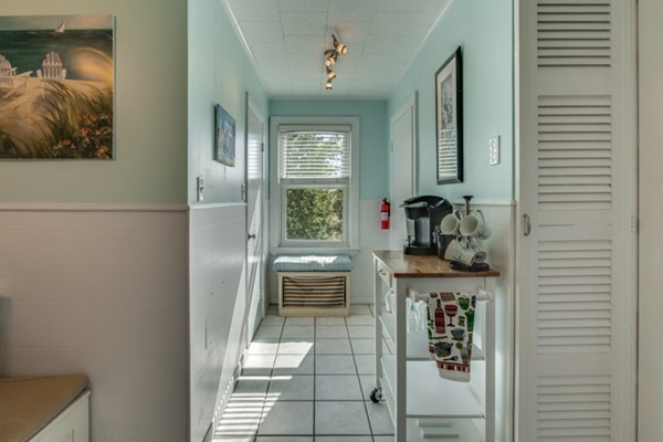 37 Wellman Street, Unit 3 Beverly, MA 01915 - Photo 10 of 21 a room with a table and chairs