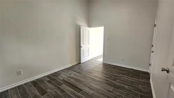 a bathroom with a sink and mirror with toilet