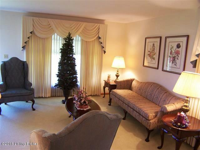 10907 Deering Road Louisville, KY 40272 - Photo 22 of 38 Spacious Living Room with carpeting, entry closet, hardwood underneath the carpeting, 2 large windows for natural lighting, storm door and open to the Dining Room.