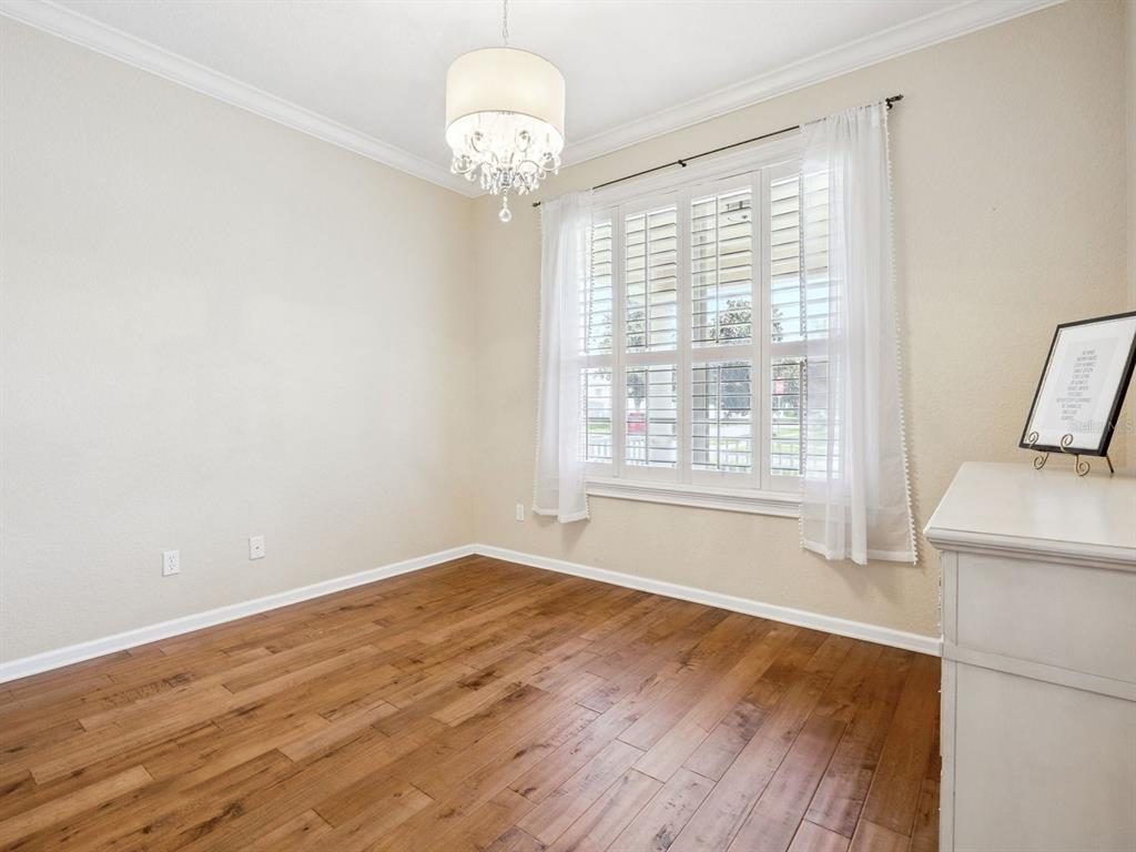 13403 Riggs Way Windermere, FL 34786 - Photo 21 of 47 a view of empty room with wooden floor and fan