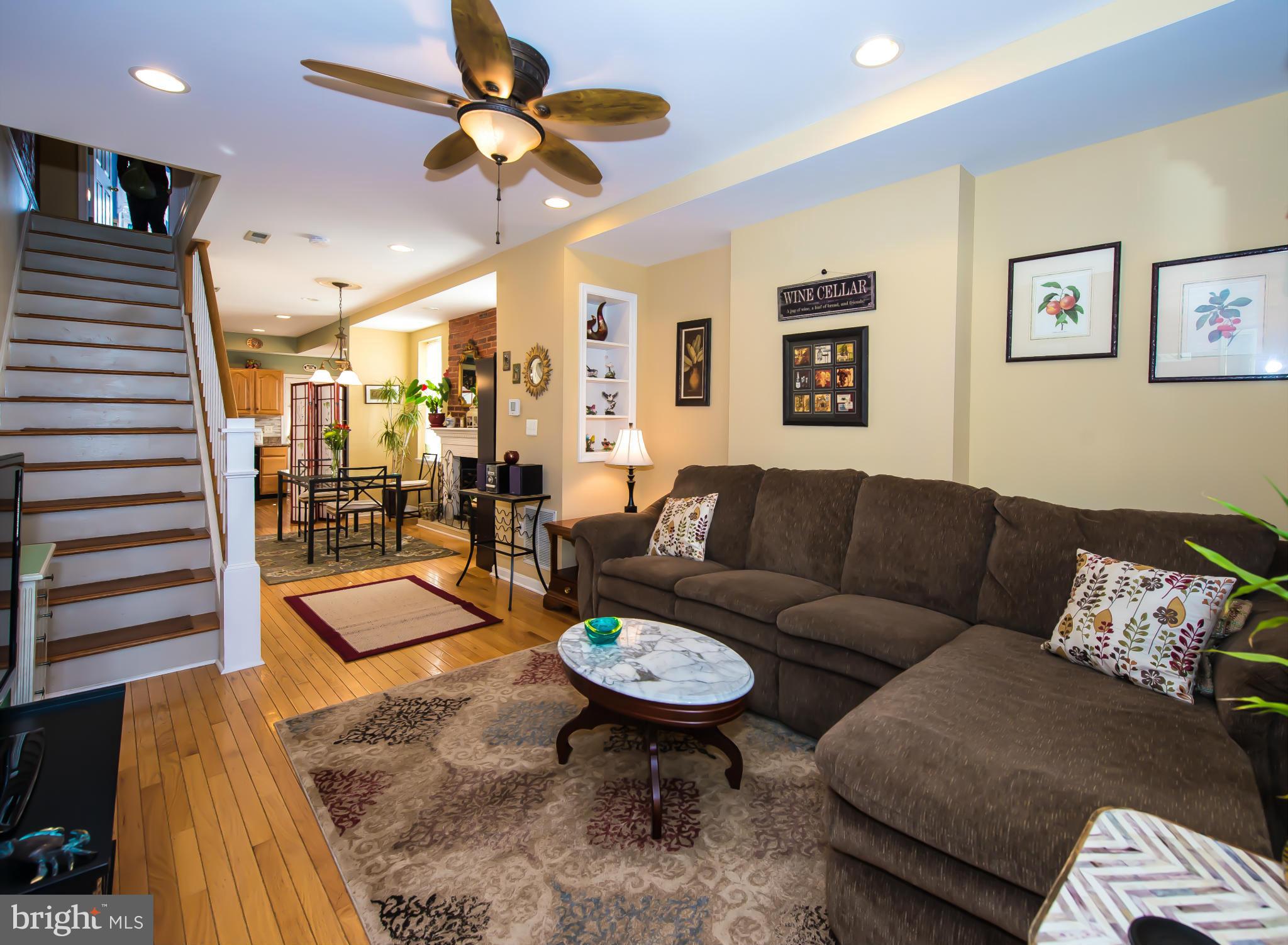 819 South Potomac Street Baltimore, MD 21224 - Photo 2 of 30 a living room with furniture and a chandelier