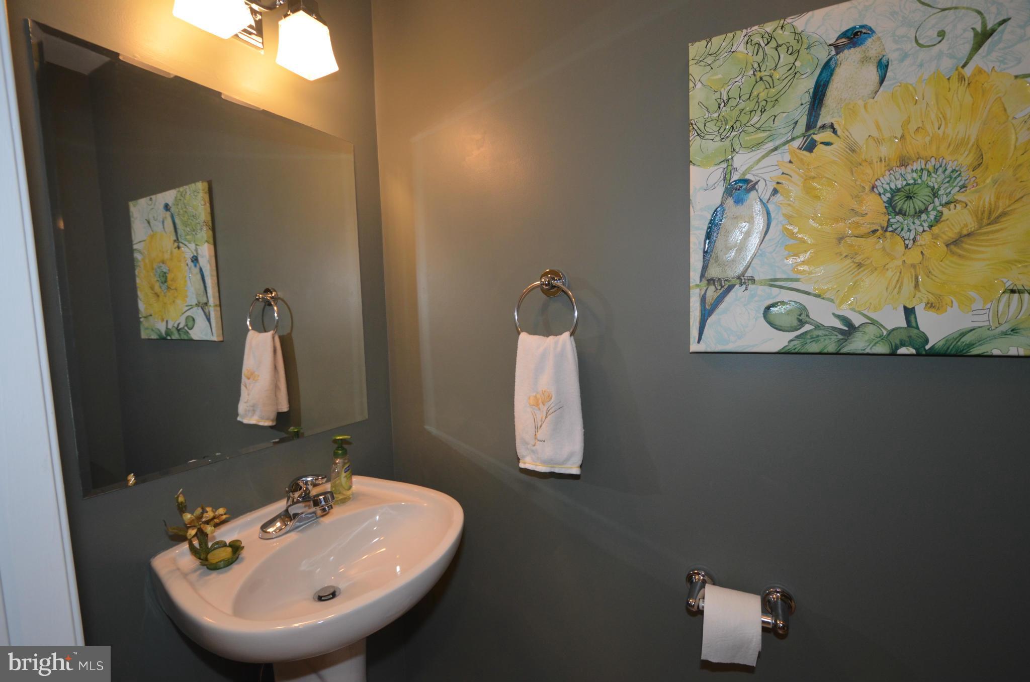 819 South Potomac Street Baltimore, MD 21224 - Photo 11 of 30 a bathroom with a sink and a mirror