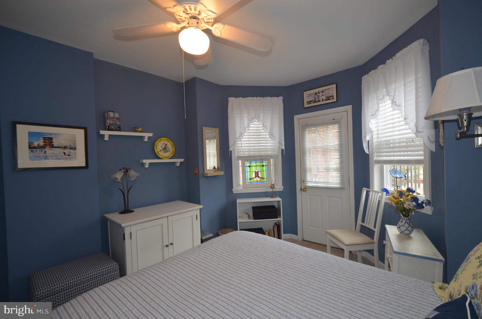 819 South Potomac Street Baltimore, MD 21224 - Photo 12 of 30 a bedroom with a bed and a chandelier