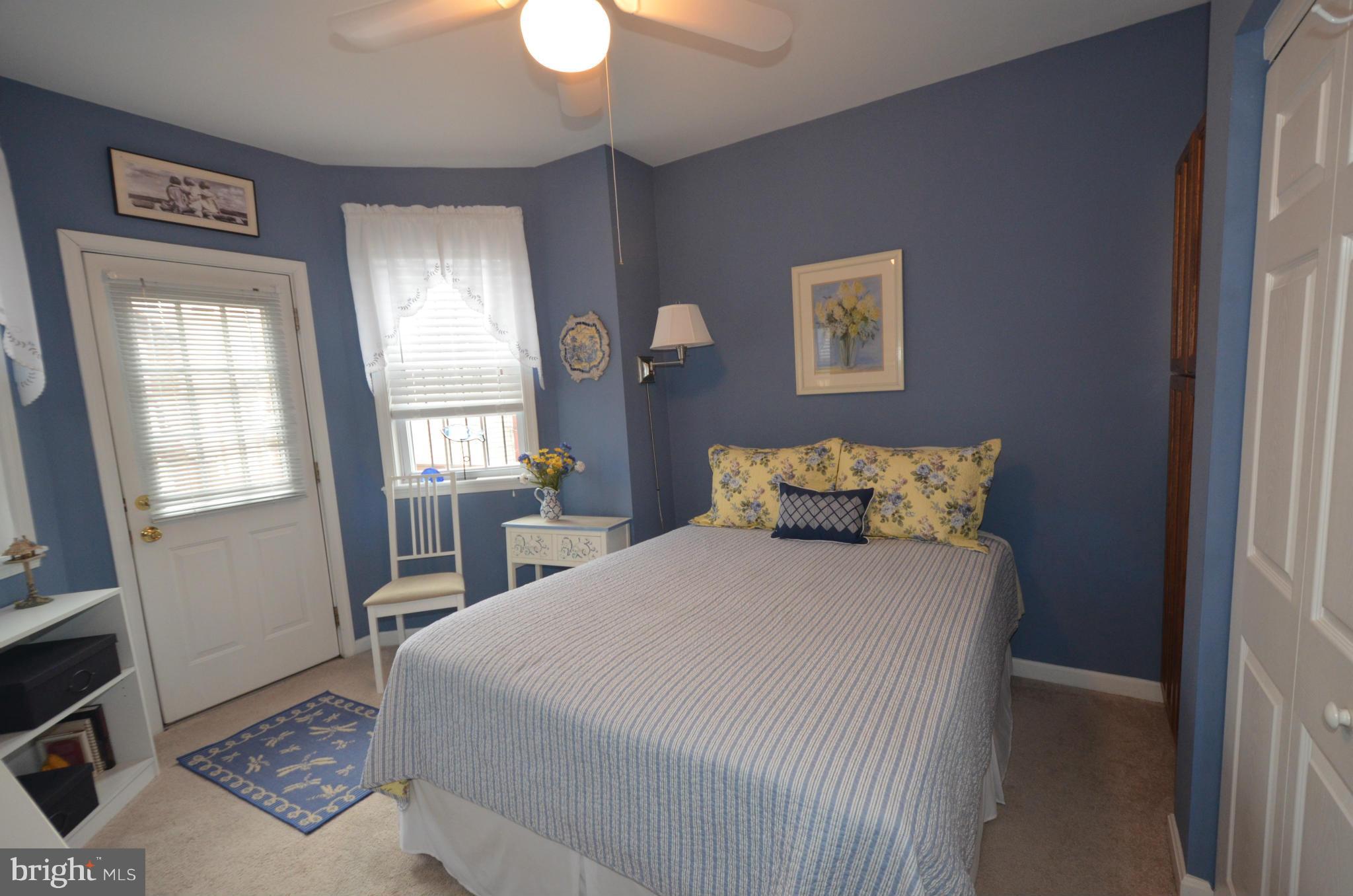 819 South Potomac Street Baltimore, MD 21224 - Photo 13 of 30 a bedroom with a bed and a window