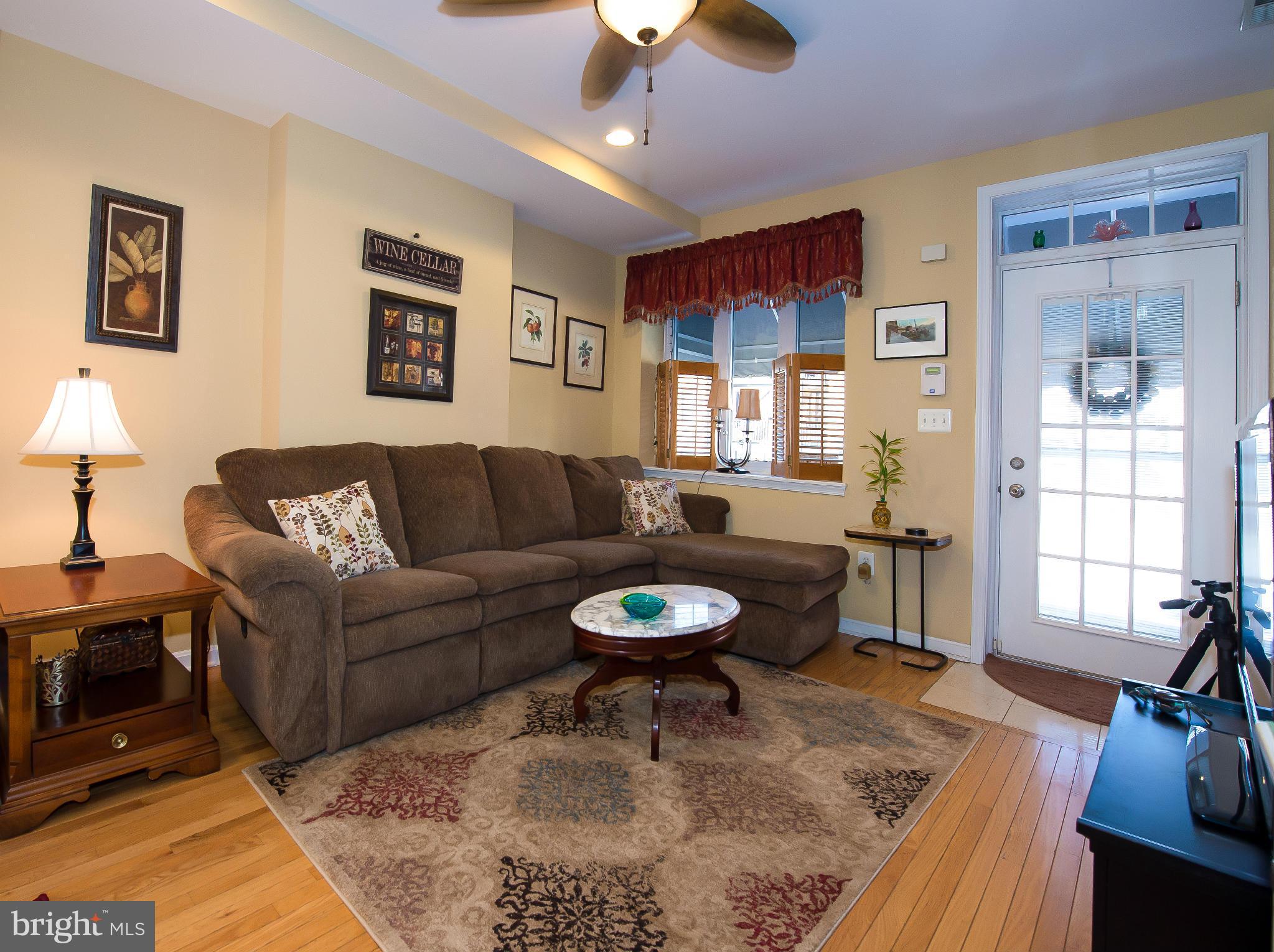 819 South Potomac Street Baltimore, MD 21224 - Photo 3 of 30 a living room with furniture and a flat screen tv