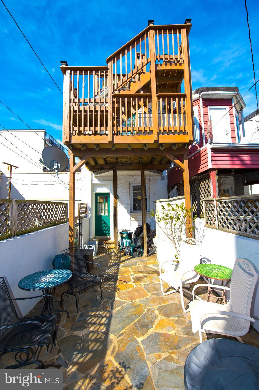 819 South Potomac Street Baltimore, MD 21224 - Photo 28 of 30 a front view of a building with outdoor seating