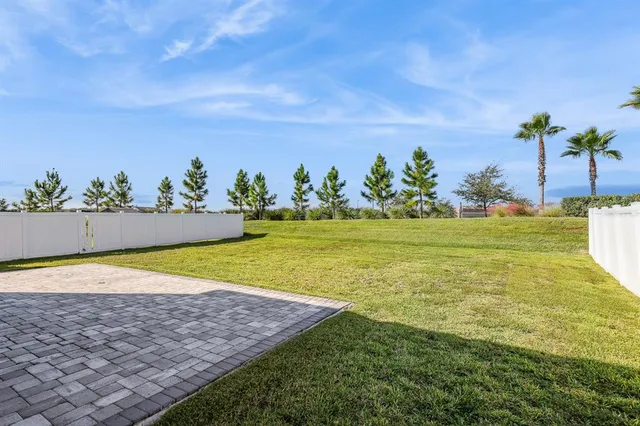 a view of a swimming pool with an outdoor space and seating area