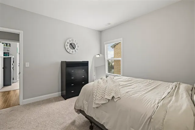 a kitchen with furniture a sink and stainless steel appliances