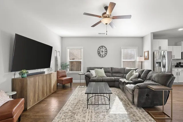 a view of a dining room with furniture and wooden floor