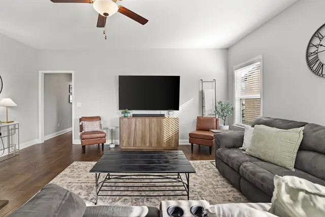 a bedroom with bed and a chandelier