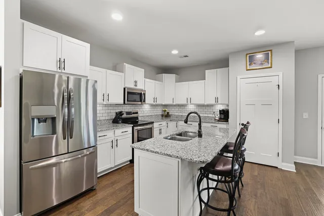 a bathroom with a tub a shower and a mirror