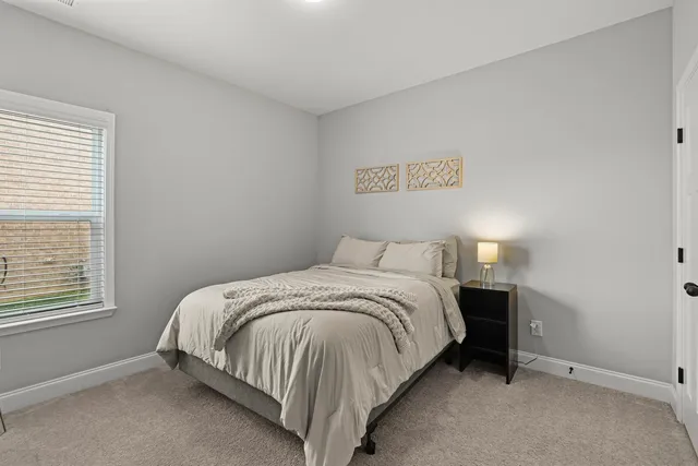 a kitchen with granite countertop a sink a stove and cabinets
