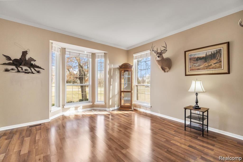 201 Timber Ridge Drive Highland, MI 48357 - Photo 7 of 39 Front living room with bay window and lots of natural light