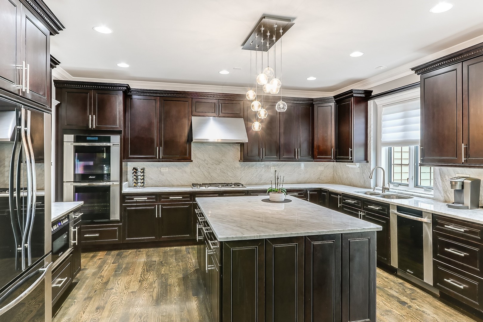 1839 Rizzi Lane Bartlett, IL 60103 - Photo 15 of 50 a kitchen with stainless steel appliances a sink stove and refrigerator