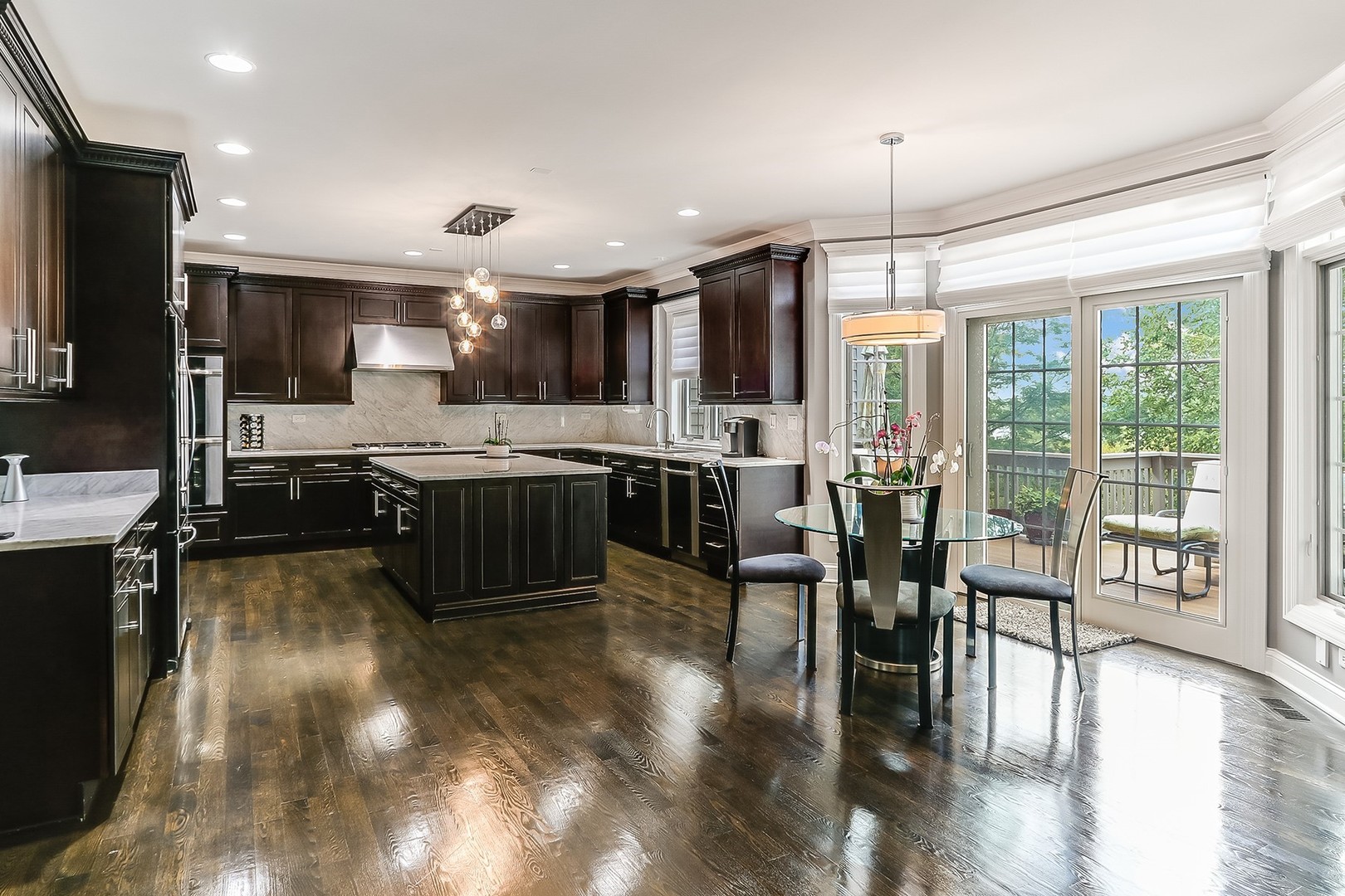 1839 Rizzi Lane Bartlett, IL 60103 - Photo 17 of 50 a large kitchen with lots of counter space a sink and appliances