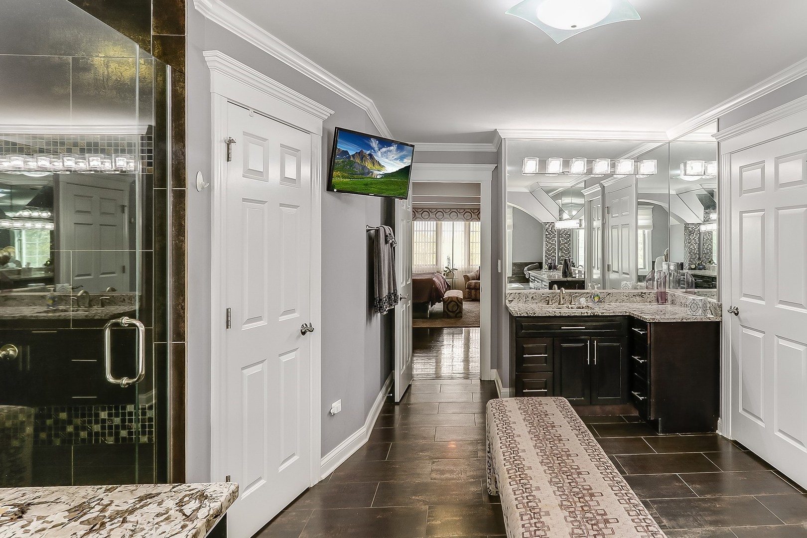 1839 Rizzi Lane Bartlett, IL 60103 - Photo 27 of 50 a bathroom with a sink a mirror and shower