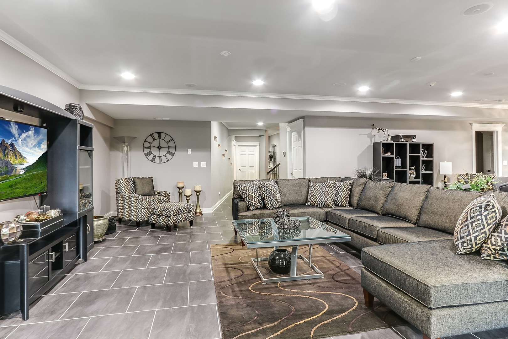 1839 Rizzi Lane Bartlett, IL 60103 - Photo 33 of 50 a living room with furniture and a flat screen tv