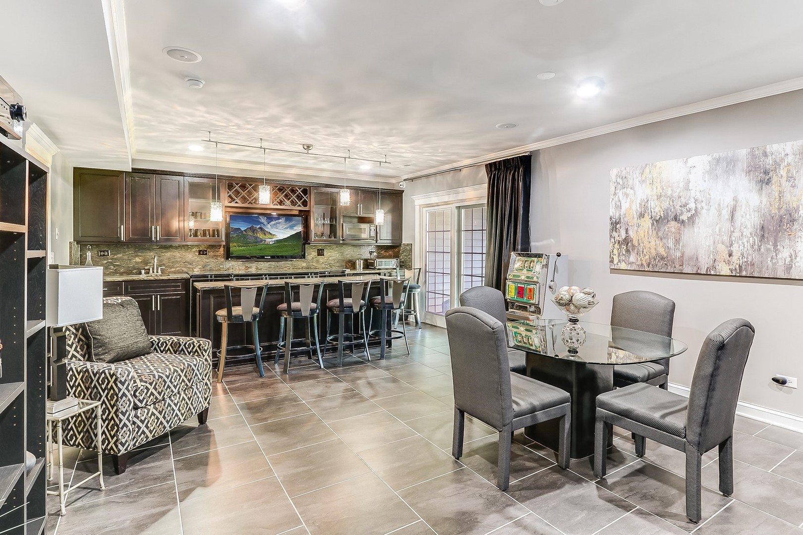 1839 Rizzi Lane Bartlett, IL 60103 - Photo 35 of 50 a dining area with furniture a table and kitchen view