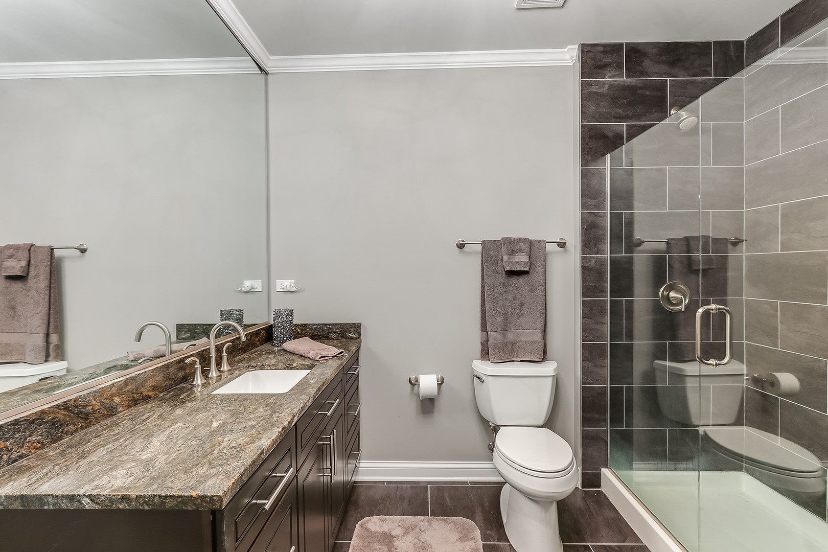 1839 Rizzi Lane Bartlett, IL 60103 - Photo 38 of 50 a bathroom with a granite countertop sink toilet and shower