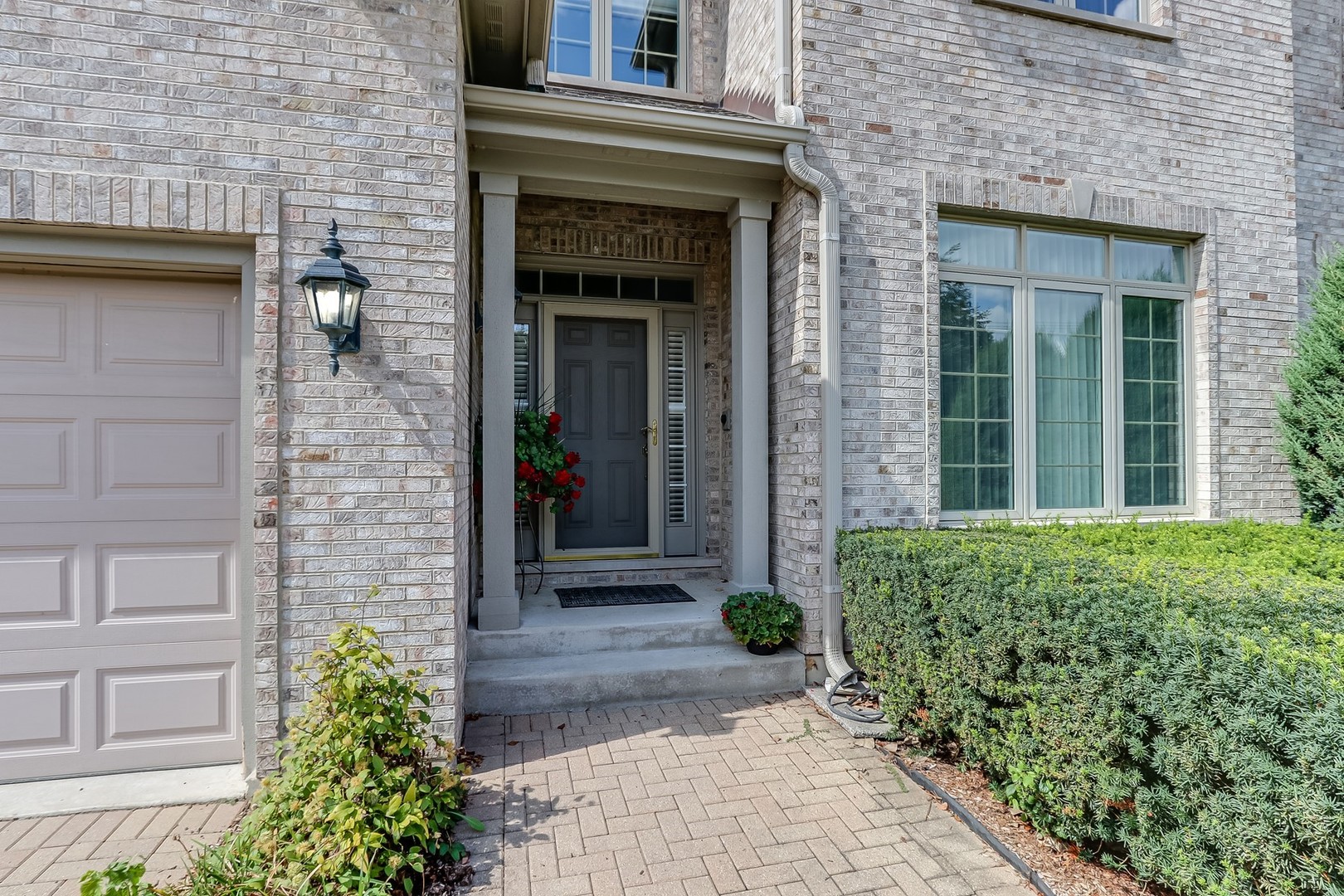 1839 Rizzi Lane Bartlett, IL 60103 - Photo 45 of 50 a front view of a house with garden