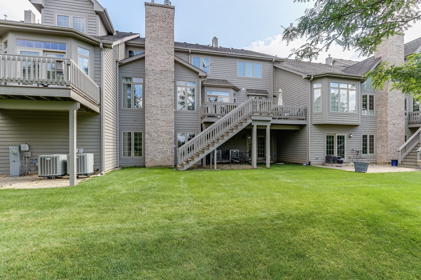 1839 Rizzi Lane Bartlett, IL 60103 - Photo 46 of 50 a view of an house with backyard space and balcony