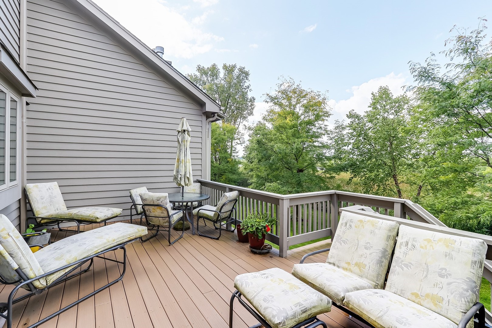 1839 Rizzi Lane Bartlett, IL 60103 - Photo 47 of 50 a balcony with wooden floor and furniture