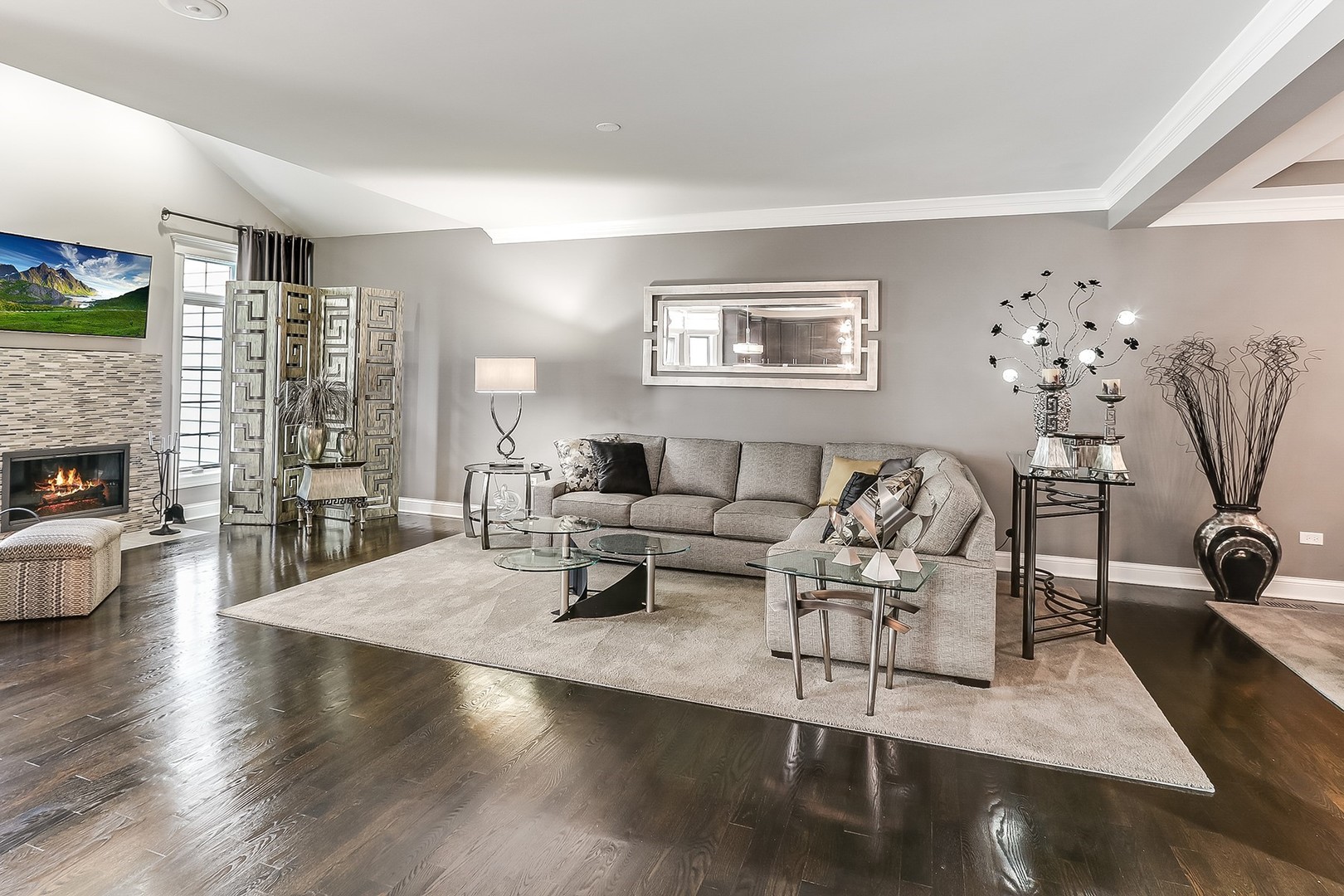 1839 Rizzi Lane Bartlett, IL 60103 - Photo 10 of 50 a living room with furniture wooden floor and a fireplace