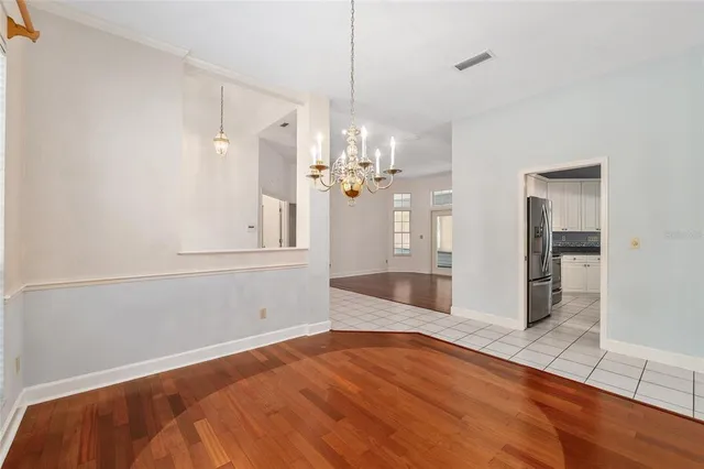 an empty room with furniture and a fireplace