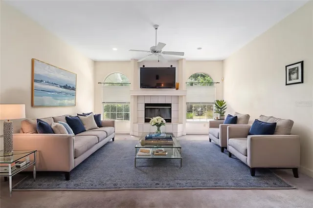 a living room with furniture and a fireplace