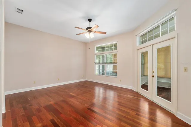 a spacious bathroom with a double vanity sink mirror and a bathtub