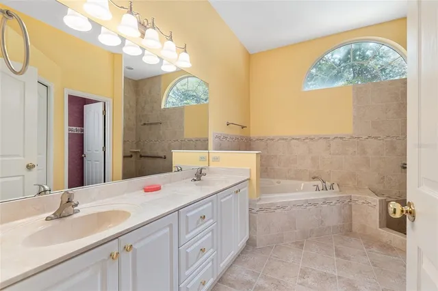 a bathroom with a bathtub and a sink