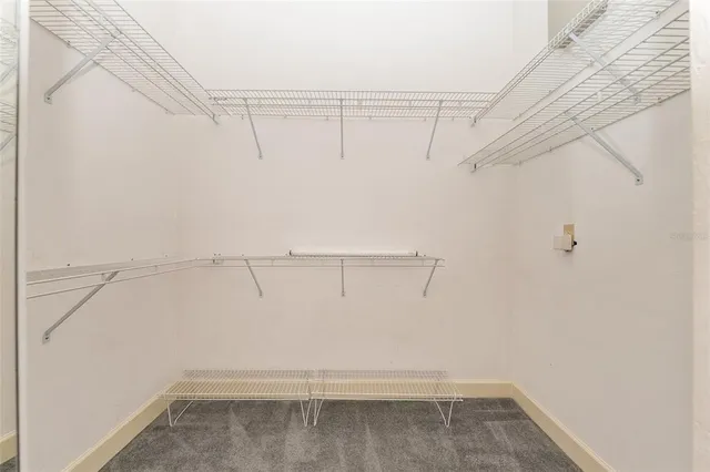 a view of a livingroom with furniture and a window