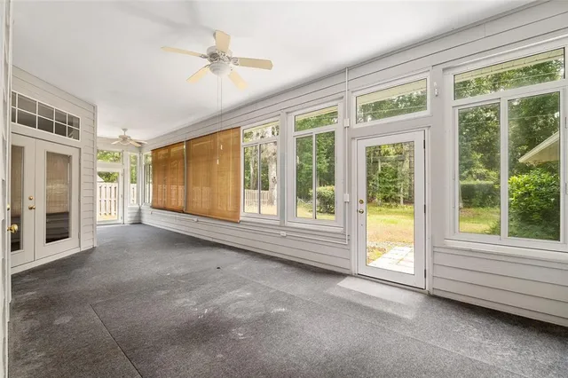 a front view of a house with yard and garage
