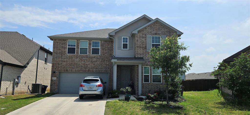 505 Virginia Way Princeton, TX 75407 - Photo 1 of 22 a front view of a house with a garden