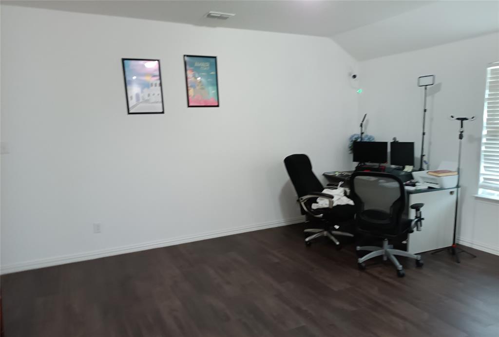505 Virginia Way Princeton, TX 75407 - Photo 16 of 22 a view of a workspace with furniture and a window