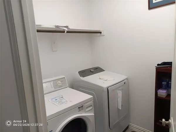 a white toilet sitting next to a bath tub
