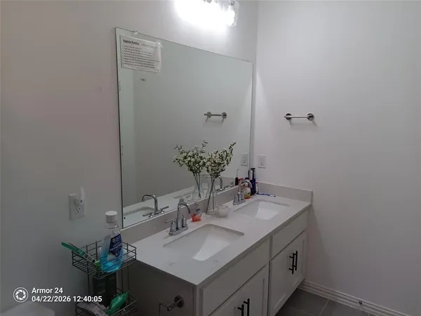 a white bath tub sitting in a bathroom next to a window