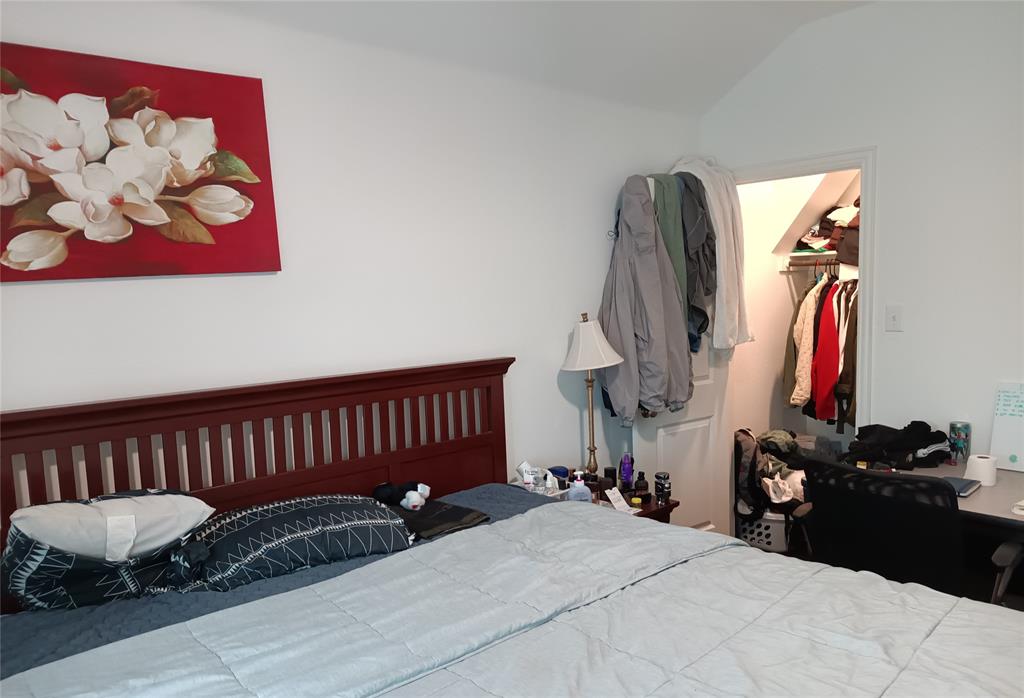 505 Virginia Way Princeton, TX 75407 - Photo 21 of 22 a bed room with a bed and a chair
