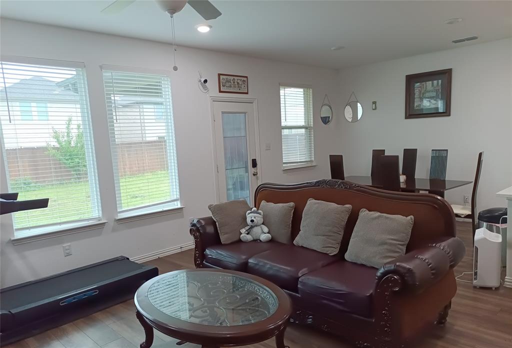 505 Virginia Way Princeton, TX 75407 - Photo 3 of 22 a living room with furniture and a window